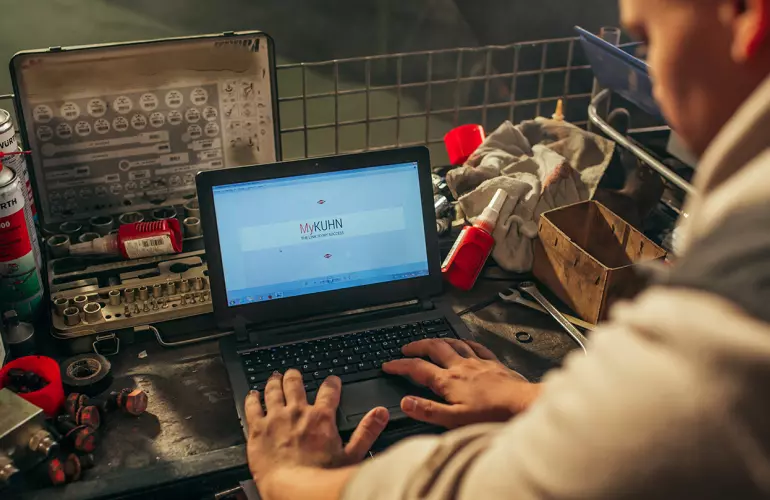 A farmer looking for a user manual in MyKUHN